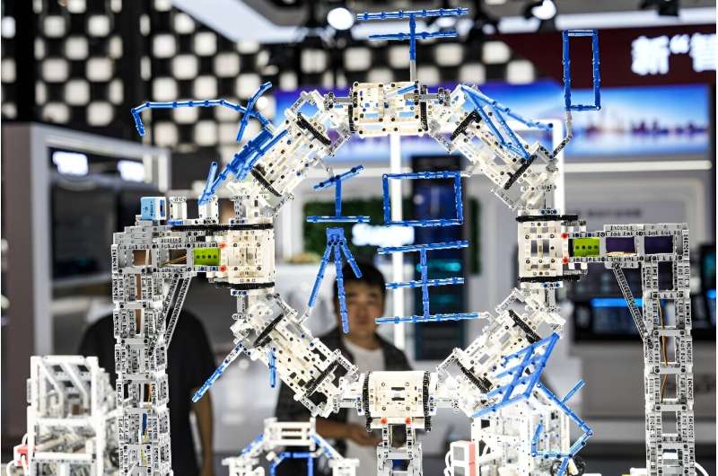 A man looks at a display at the artificial intelligence conference in Shanghai