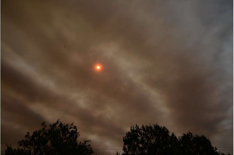 A sunset is seen through smoke from wildfires in Brazil's Pantanal June 28, 2024
