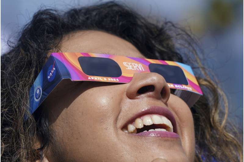 A total solar eclipse races across North America as clouds part along totality