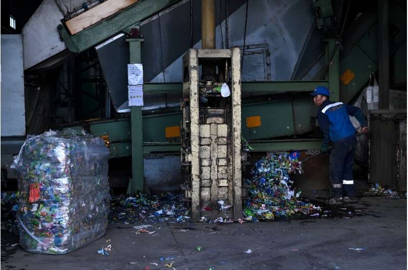 A worker at a plastic processing plant where bottles are recycled to make pet resin in Ulaanbaatar