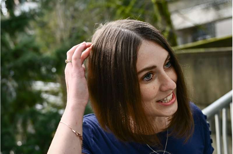 Amber Pearson, who received a brain implant to treat her epilepsy and Obsessive Compulsive disorder (OCD), shows the approximate placement of a brain implant received at the Oregon Health and Science University (OHSU) hospital in Portland, Oregon