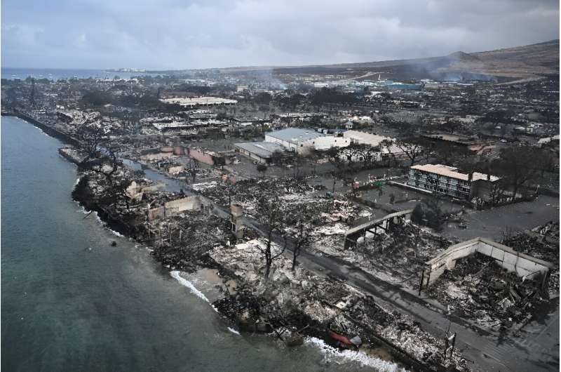 An aerial image shows Old Lahaina Center and Foodland Lahaina standing amongst destroyed homes and businesses along Front Street burned to the ground in the historic Lahaina in the aftermath of wildfires in western Maui in Lahaina, Hawaii