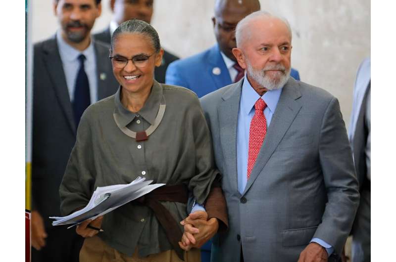 Brazilian President Luiz Inacio Lula da Silva (R) and his Minister of Environment, Mariana Silva, arrive at a ceremony to mark World Environment Day at the Planalto Palace in Brasilia