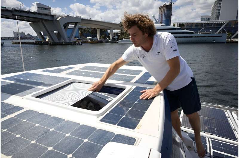 Captain Marin Jarry of the Energy Observer, the first hydrogen-powered, zero-emission vessel to be self-sufficient in energy, closes the pilot cockpit window, at Pier Sixty Six Marina in Fort Lauderdale, Florida, on February 27, 2024