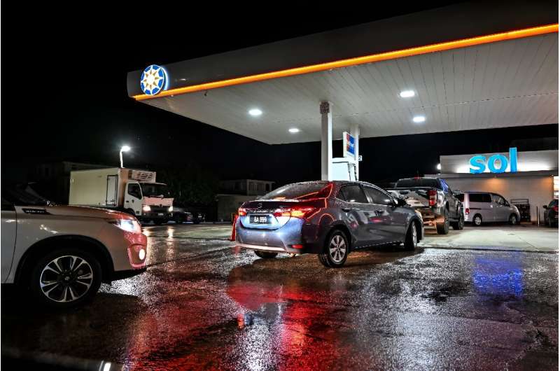 Cars line up at a gas station as Hurricane Beryl heads towards Bridgetown, Barbados, on June 29, 2024