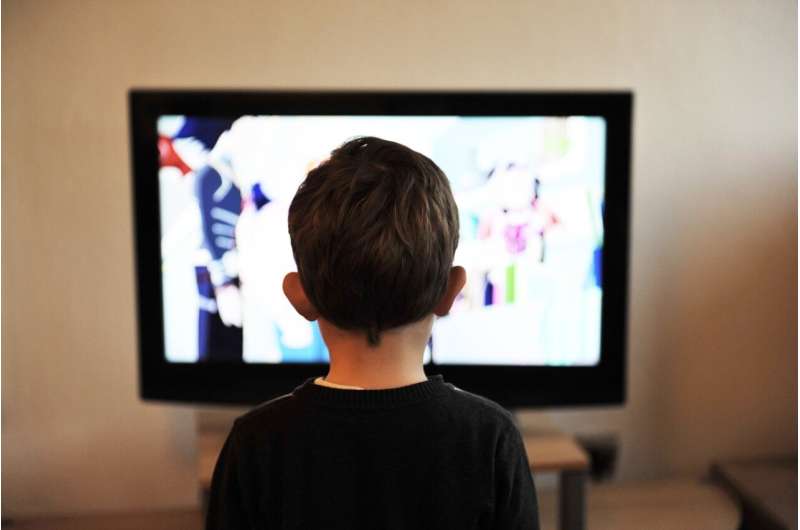 child in front of tv