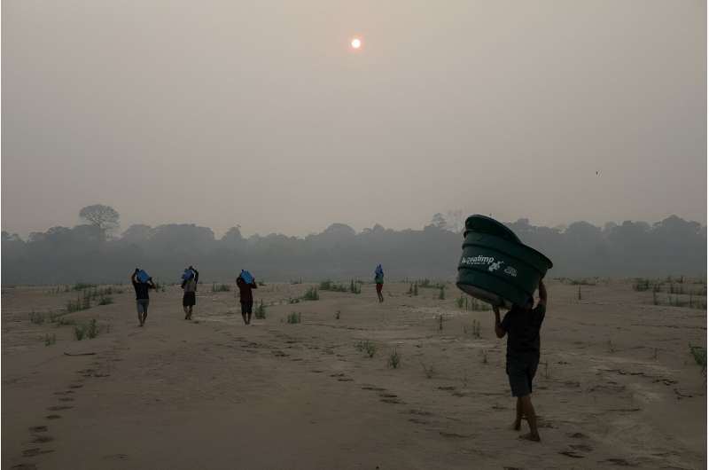 Communities all along the banks of the Madeira River, an important route for the trade of soybeans, fish, and fuel, are struggling