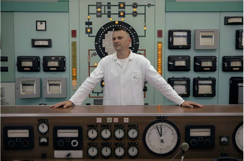 Dalibor Arbutina, director of Public Company Nuclear Facilities of Serbia (NFS), stands in the control room of a decommissioned nuclear reactor