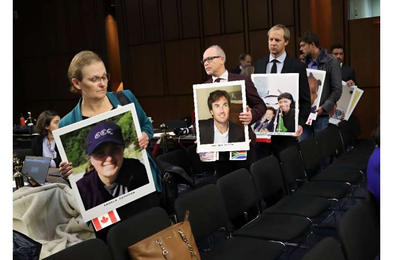 Family members of those who died aboard Ethiopian Airlines Flight 302 arrive with pictures of their loved ones during a U.S. Senate Commerce Committee hearing