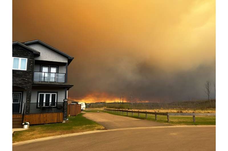 Fort McMurray in Canada's Alberta province was partially evacuated as a growing wildfire neared the city