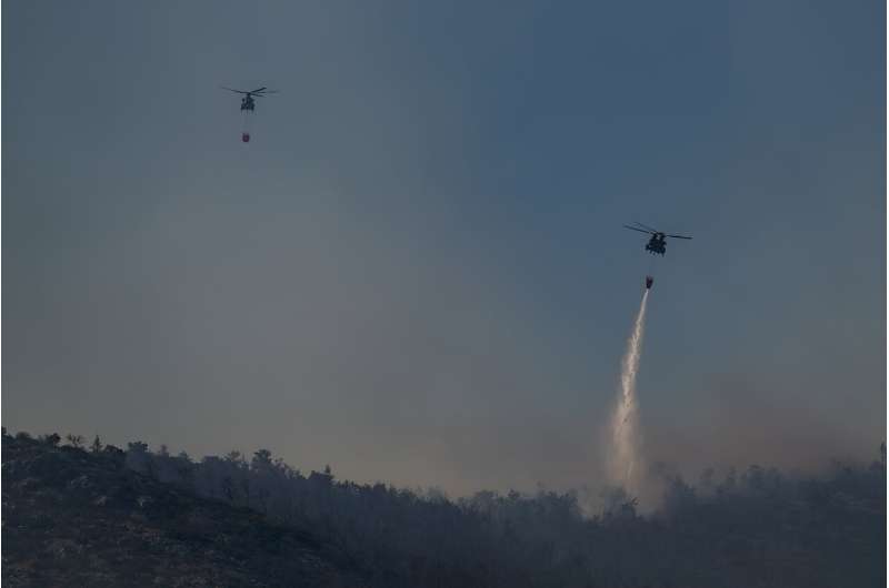 Greece is battling dozens of wildfires  -- one at Mount Parnitha, known as  "the lungs of Athens" was brought under control late Saturday  