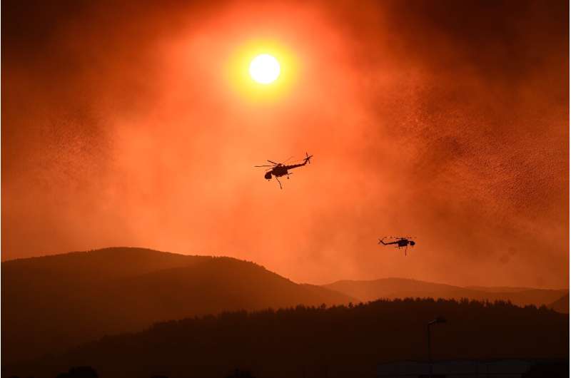 Helicopters fly over as wildfire rages near Alexandroupoli in northern Greece in August last year