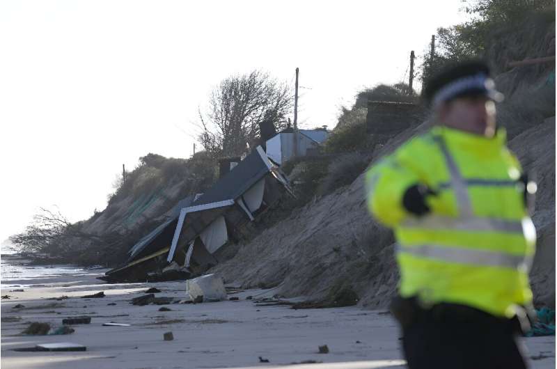 Hemsby, in Norfolk, eastern England, has been hit by tidal surges, washing houses in to the North Sea