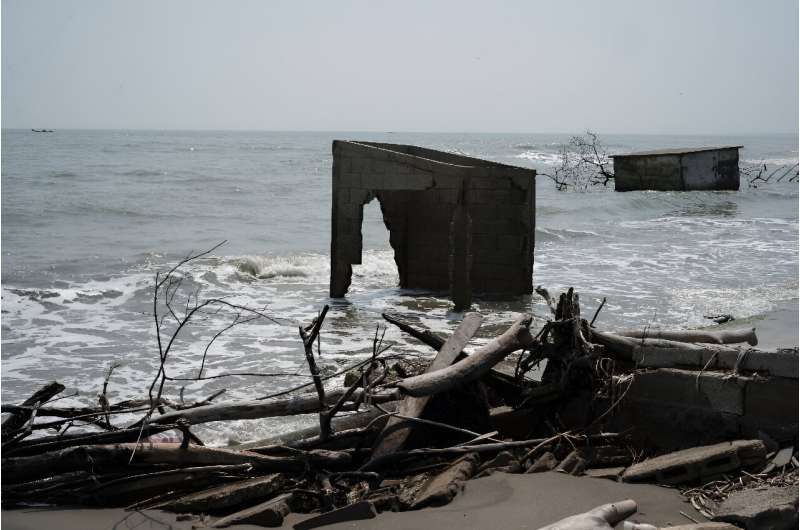 Homes destroyed by the sea are seen in the community of El Bosque in southern Mexico