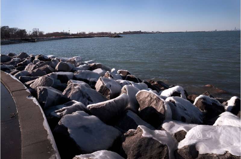Ice collects on boulders along the Lake Michigan shoreline on February 18, 2024 in Whiting, Indiana; the Great Lakes shorelines have historically been ice-covered this time of year, but this winter's warm weather has led to historically low ice cover