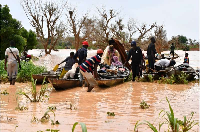 In Niger, people were forced to use canoes after heavy rains damaged main roads