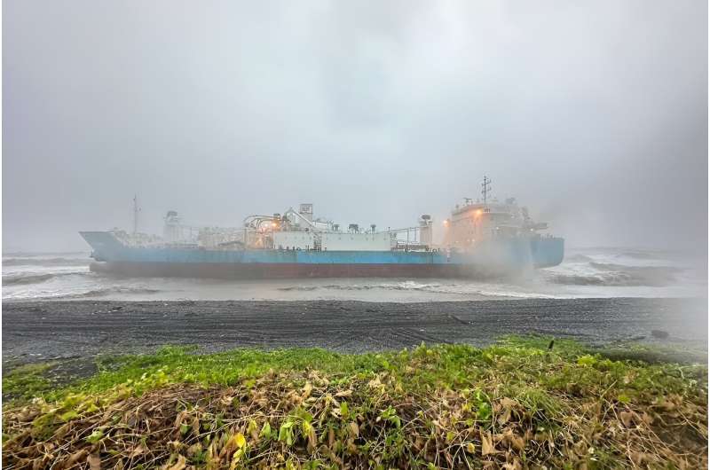In Pingtung county, an Indonesian freighter had to be anchored at a beach during the storm