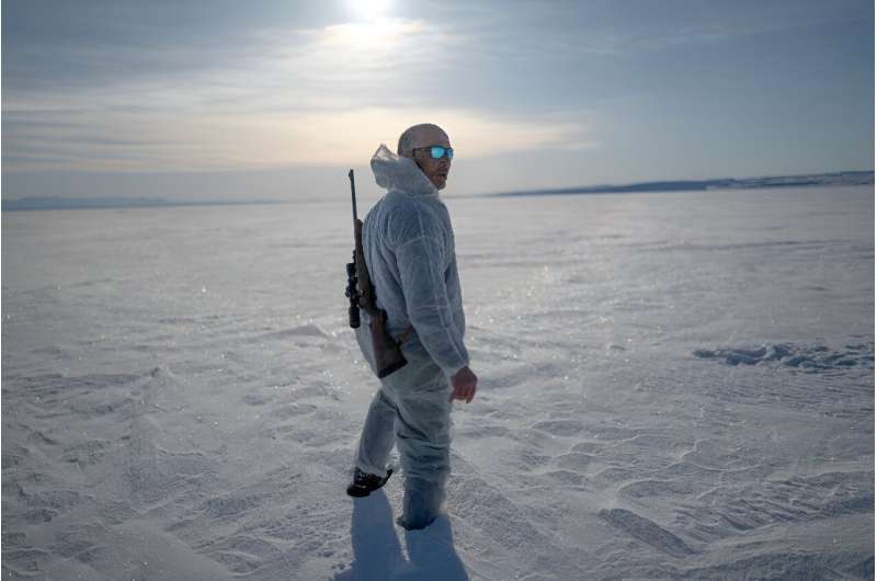 Inuit hunter Hjelmer Hammeken, 66, heads out alone onto the Greenland ice