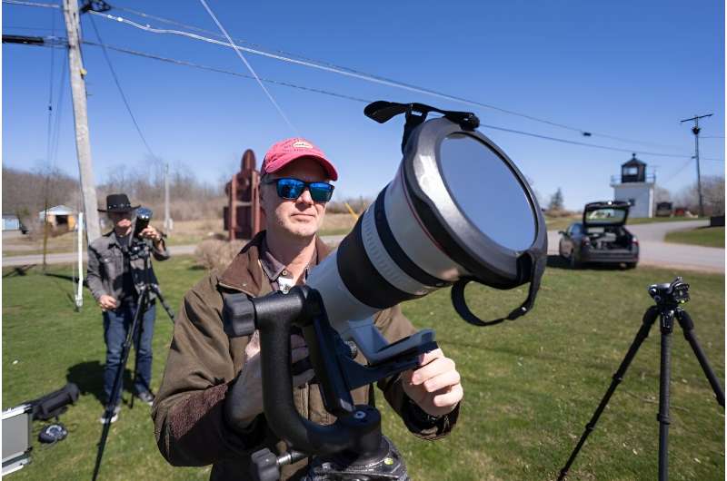 John Bills tests his camera equipment on the eve of a total solar eclipse across North America, in Cape Vincent, New York, on April 7, 2024