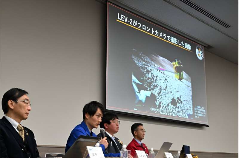 Members of the Japanese space agency JAXA explain an image of the lunar surface taken and transmitted by a surface robot deployed after the Smart Lander for Investigating Moon (SLIM) mission landed