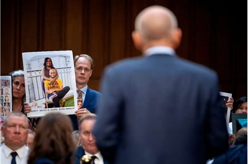 Michael Stumo and his wife Nadia Milleron, the parents of Samya Rose Stumo, listen as Boeing CEO Dave Calhoun (R) speaks directly to family members of those killed in the Ethiopian Airlines Flight 302 and Lion Air Flight 610 crashes