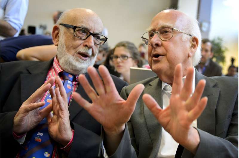 Nobel Physics laureates Peter Higgs (R) and Francois Englert applaud recognition of their mass-giving &quot;Higgs Bosun&quot; in July 2012