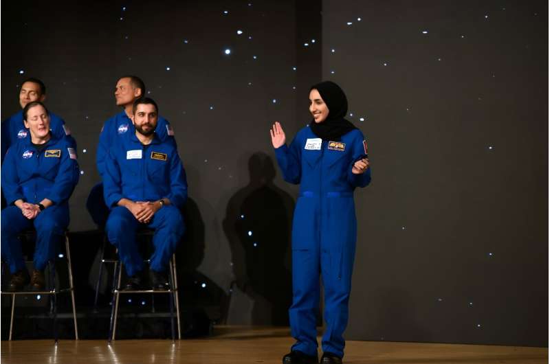 Nora Al Matrooshi (R) waves during the graduation ceremony for NASA Artemis astronaut candidates at Johnson Space Center in Houston, Texas, on March 5, 2024