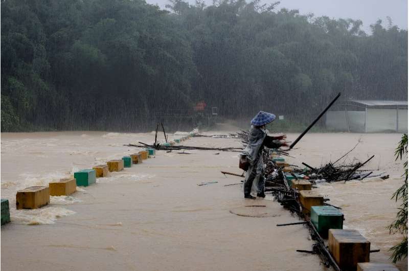 Over a dozen people were missing in China on Tuesday after heavy rains and flooding struck swathes of the south