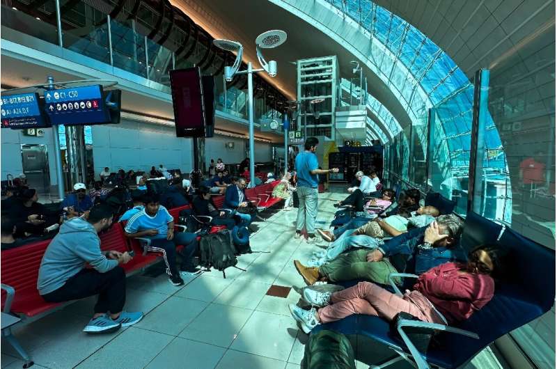 Passengers were warned not to come to Dubai airport, the world's busiest by international traffic, &quot;unless absolutely necessary&quot;