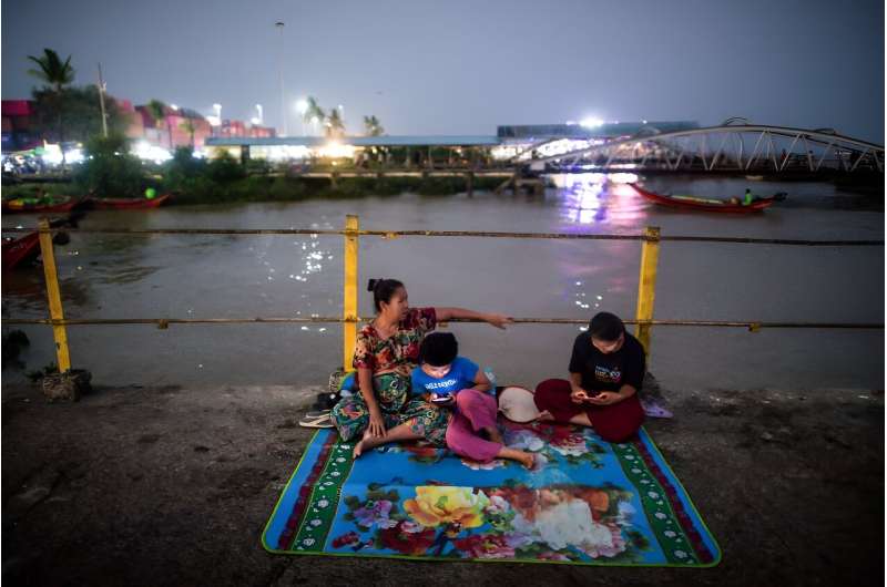 People gather at a jetty in Yangon in Myanmar, which has experienced higher-than-average April temperatures