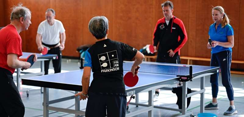 People play table tennis at the Ping Pong Parkinson initiative in Berlin on April 11, 2023, World Parkinson's Day -- the devastating disorder affects 10 million people worldwide