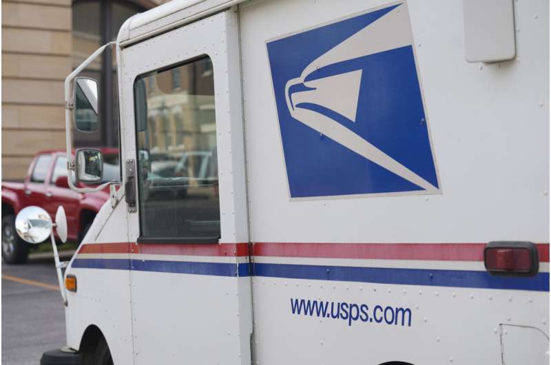 Postal Service, once chided for slow adoption of EVs, announces plan to cut greenhouse gas emissions