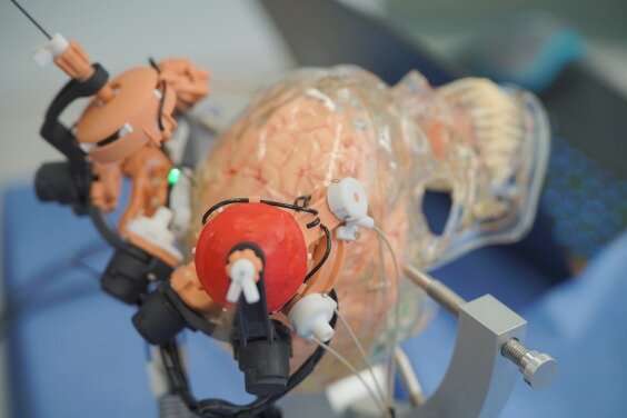Precise stereotactic neurosurgery using MRI-guided multi-stage robotic positioner