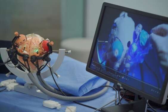 Precise stereotactic neurosurgery using MRI-guided multi-stage robotic positioner