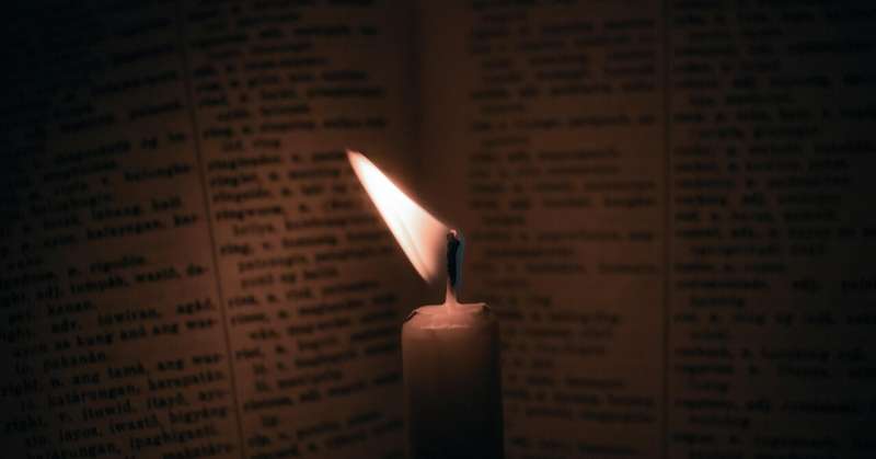 reading by candle