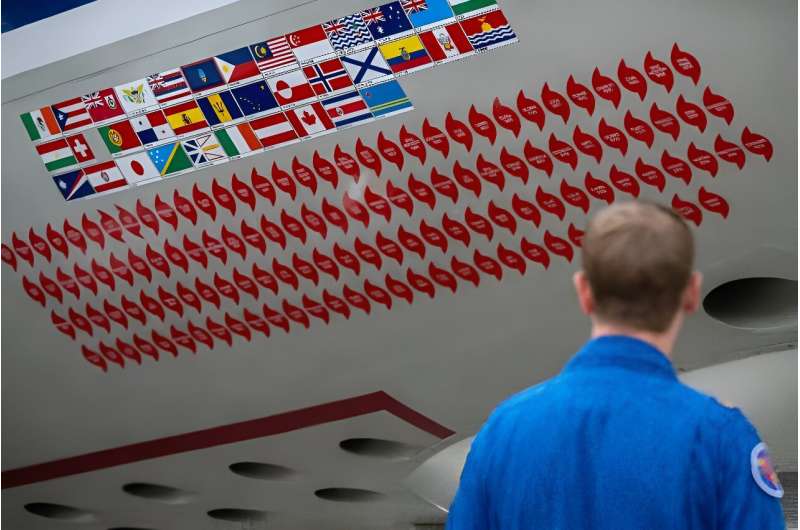 Red decals bear the names of hurricanes that this WP-3D Orian 'hurricane hunter' aircraft has flown through
