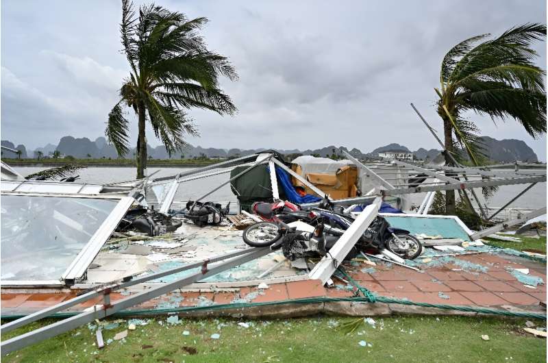 Rooftops of buildings were blown off and motorbikes were left toppled over in piles of building rubble and glass