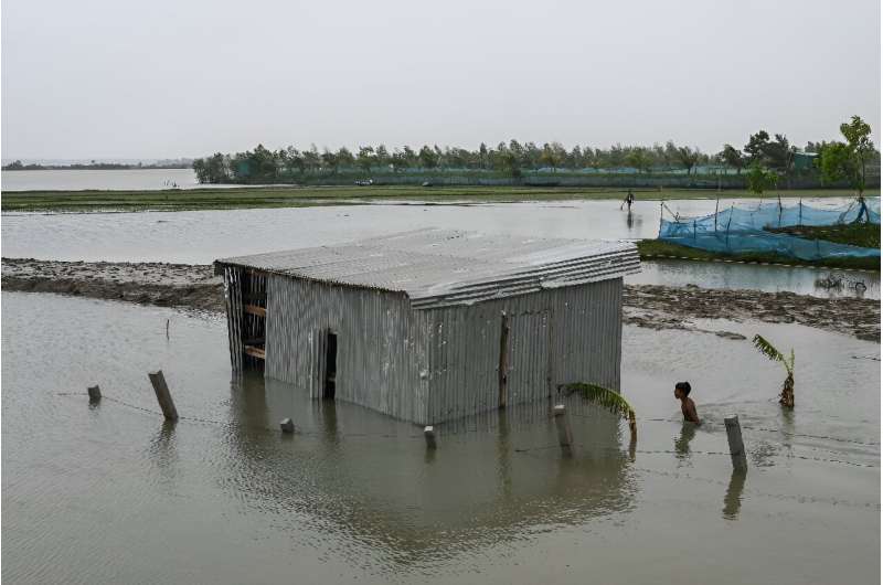 Scientists say rising seas driven by climate change are drowning Bangladesh's densely populated coast at one of the fastest global rates