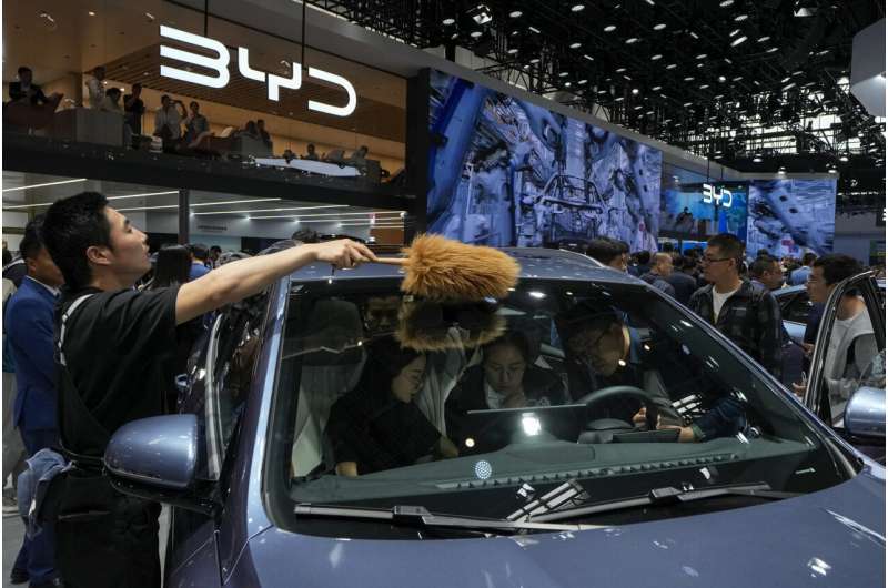 Tesla founder Musk visits China as competitors show off new electric vehicles at Beijing auto show
