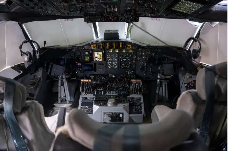 The cockpits of the two US government planes that fly into Atlantic hurricanes reflect the aircrafts' decades-old age, but the meteorological equipment on board is high-tech