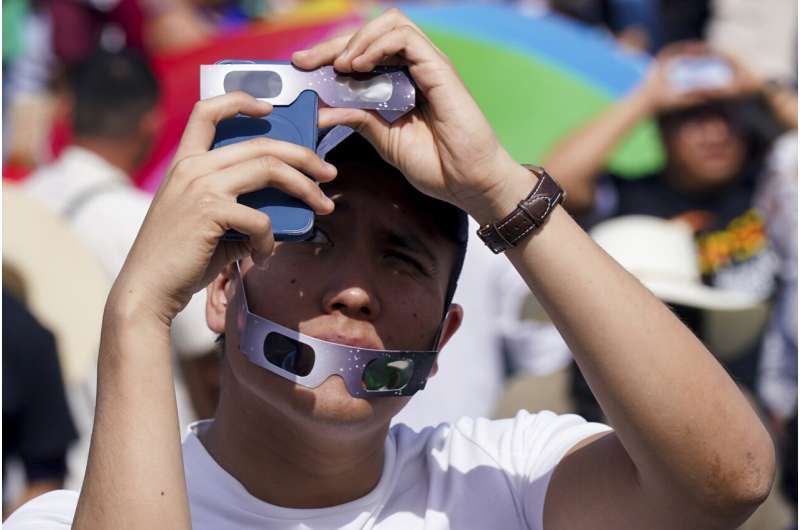 The Latest: Dallas students elated by eclipse