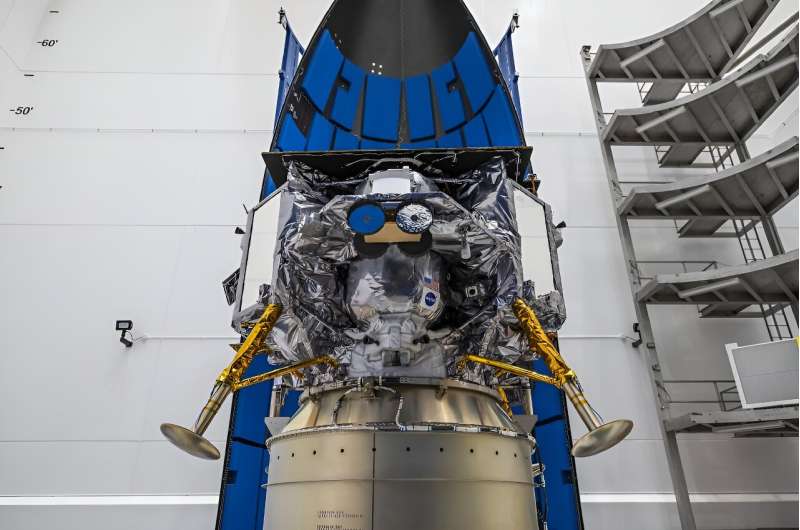 This image released by NASA shows Astrobotic's Peregrine lunar lander being encapsulated in the payload fairing, or nose cone, of United Launch Alliance's Vulcan rocket