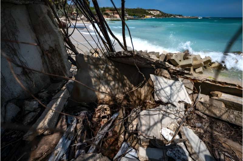 View of a grave destroyed due to sea level rise at the Tierra Bomba island cemetery in Cartagena, Colombia