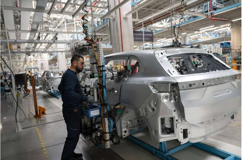 Workers on the assembly line at the Togg electric vehicle plant in western Turkey