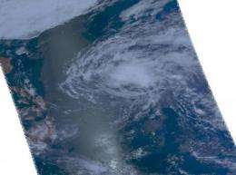 Tropical storm Omais weakens and doubles in size