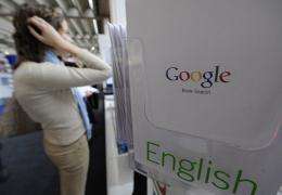 A visitor checks out the Google stand at the Frankfurt Book Fair