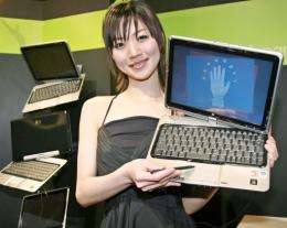 File photo shows a model posing with a Hewlett-Packard tablet PC