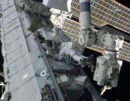 Space station cooling normally after spacewalk fix (AP)