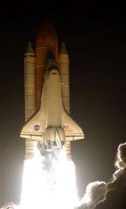 Space shuttle Endeavour pulls in at space station (AP)