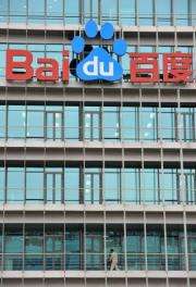 A Chinese worker cleans the balcony of Chinese Web search giant Baidu's headquarters in Beijing